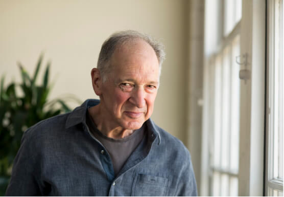 Jerry Skomer, Former owner of Alternative Technologies, stands near window in office