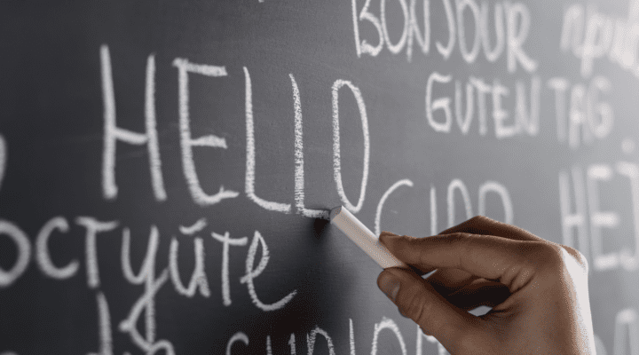 Different languages written on a chalkboard