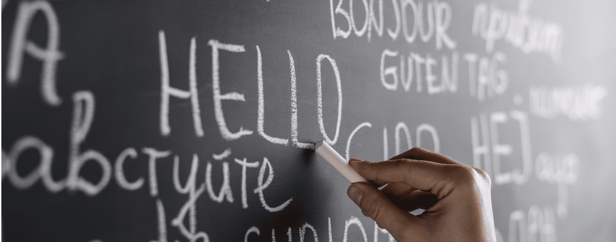 Different languages written on a chalkboard