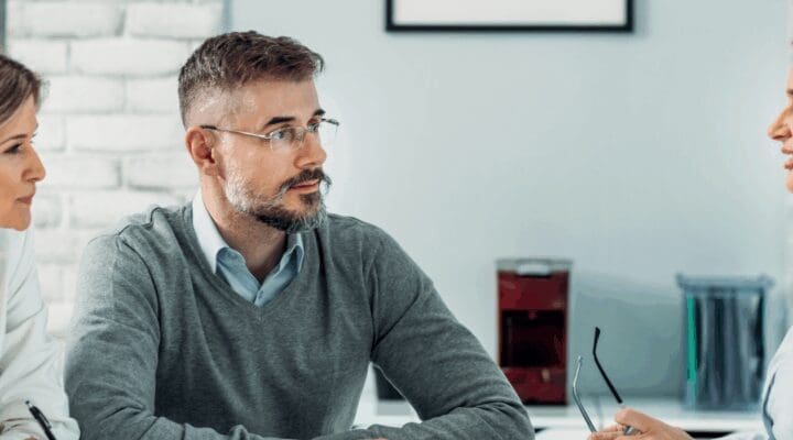 3 business people in meeting