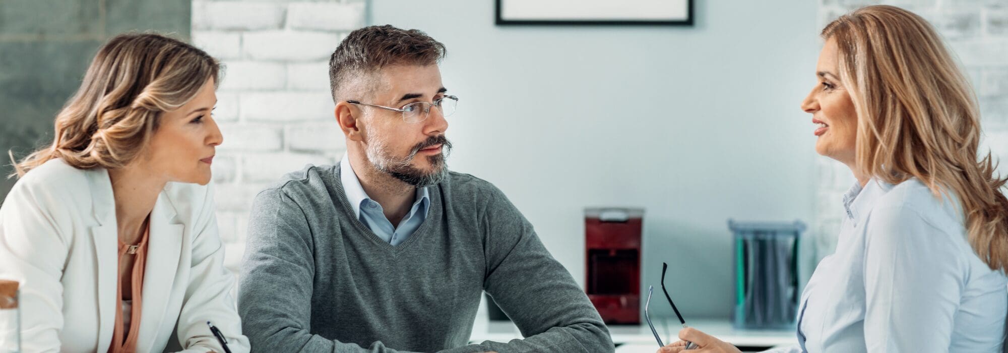 3 business people in meeting