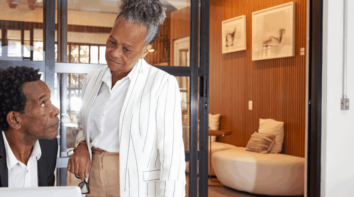 Two baby boomers looking at a laptop